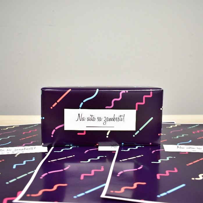 Personalised gift wrapping paper with text in a border, dark purple background