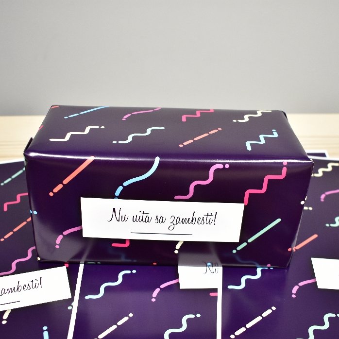 Personalised gift wrapping paper with text in a border, dark purple background