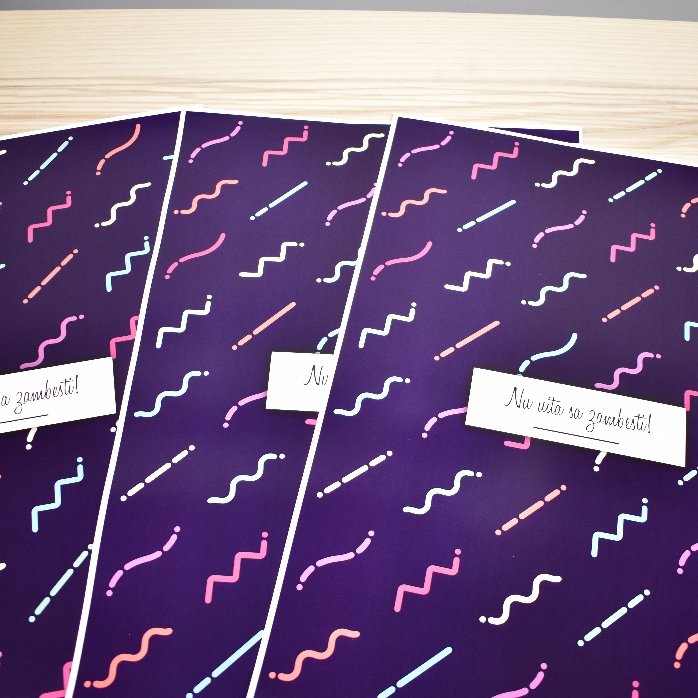 Personalised gift wrapping paper with text in a border, dark purple background